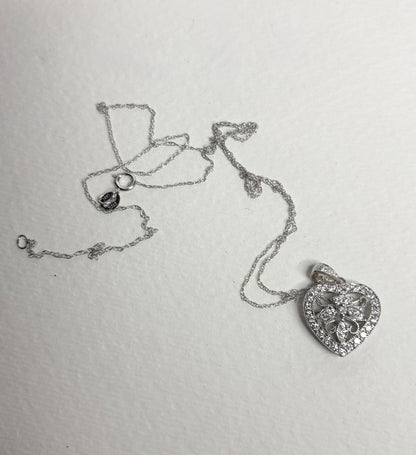 14k white gold heart pendant necklace with natural diamonds.