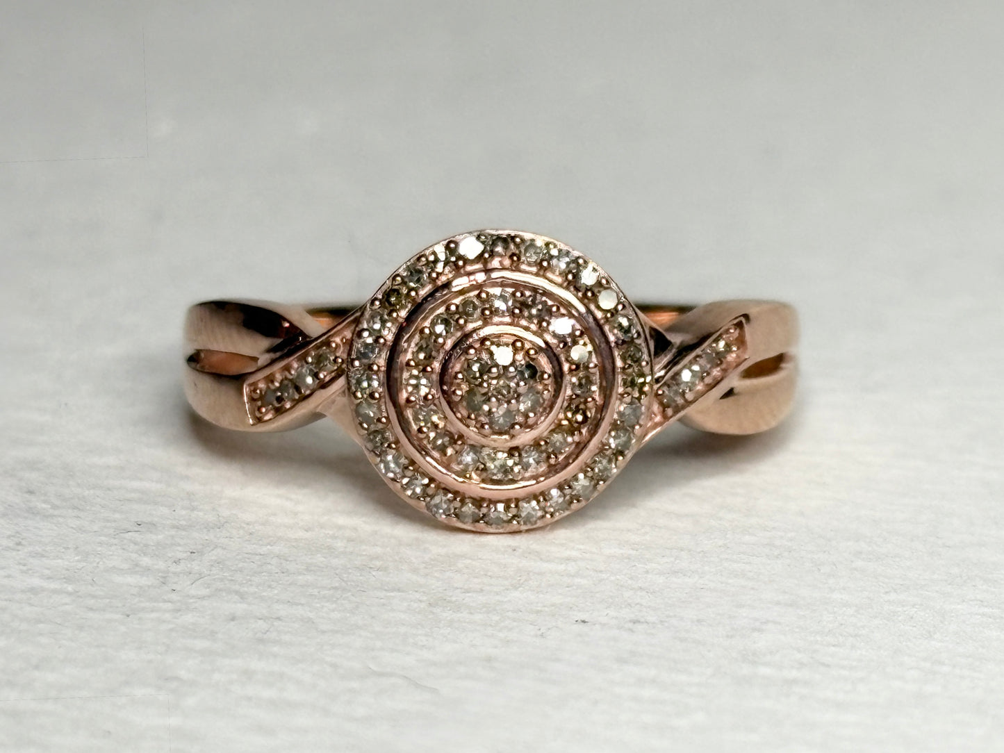 Rose gold ring with pave set champagne and brown diamonds.