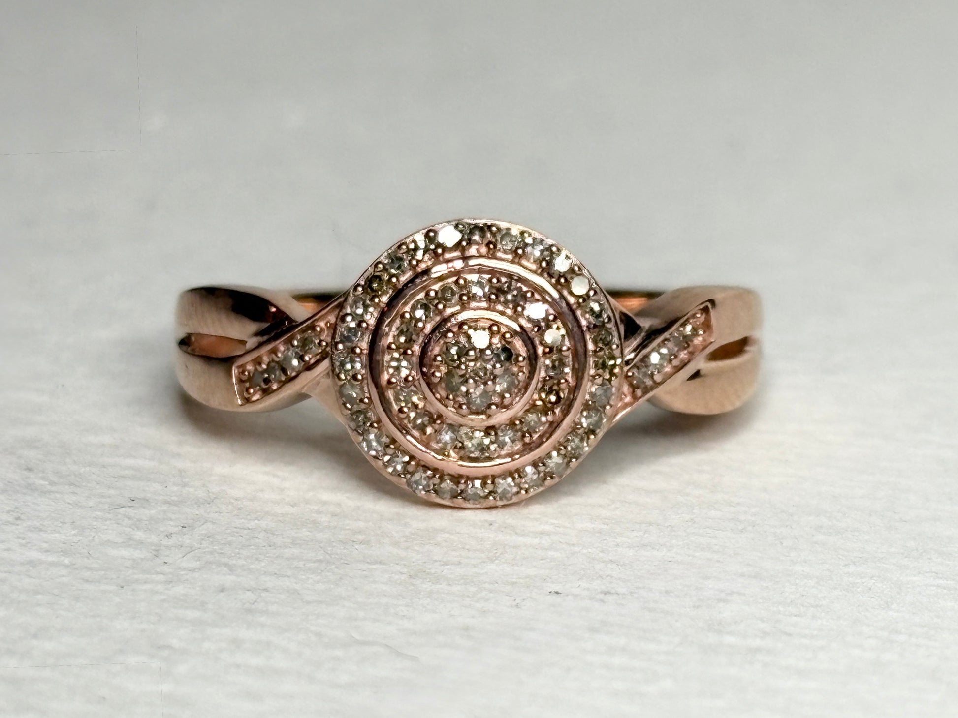 Rose gold ring with pave set champagne and brown diamonds.