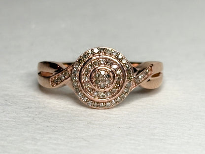 Rose gold ring with pave set champagne and brown diamonds.