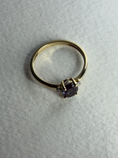 A 10k gold ring with a lab-grown alexandrite and diamonds.