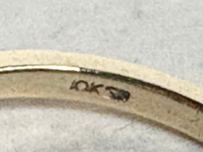 Ribbon style ring in solid 10k gold with a 10k stamp.