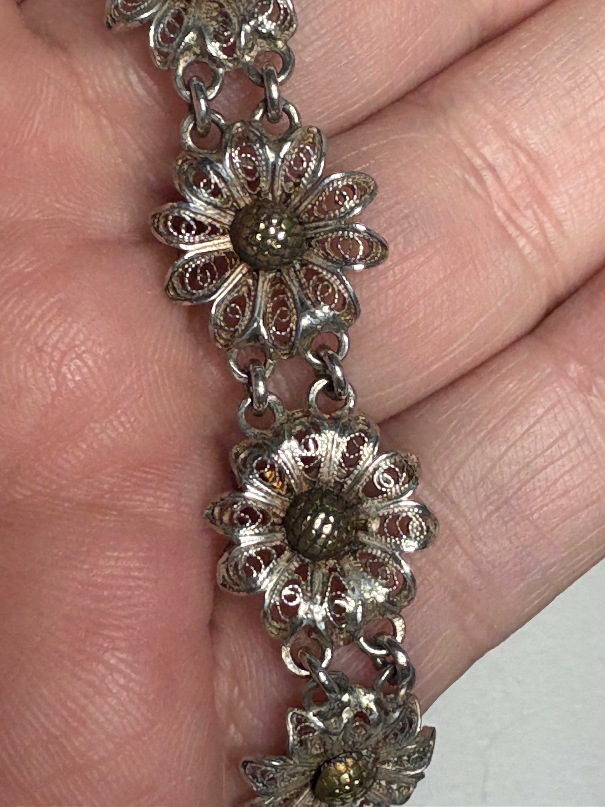 Vintage two-toned 800 silver filigree floral daisy bracelet with gold-plated centers.