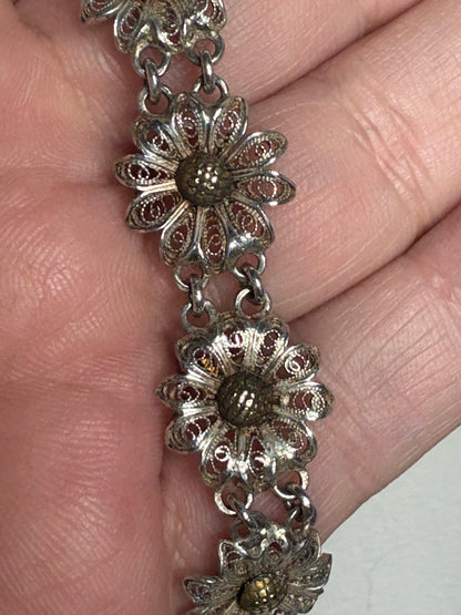 Vintage two-toned 800 silver filigree floral daisy bracelet with gold-plated centers.