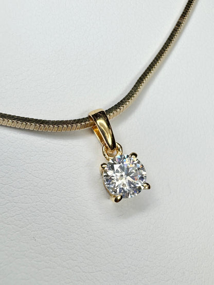 Gold over sterling silver necklace with a moissanite solitaire pendant.