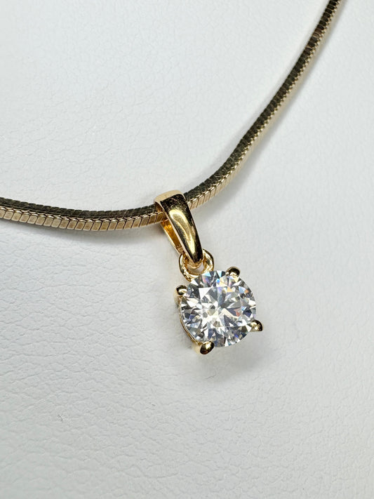 Gold over sterling silver necklace with a moissanite solitaire pendant.