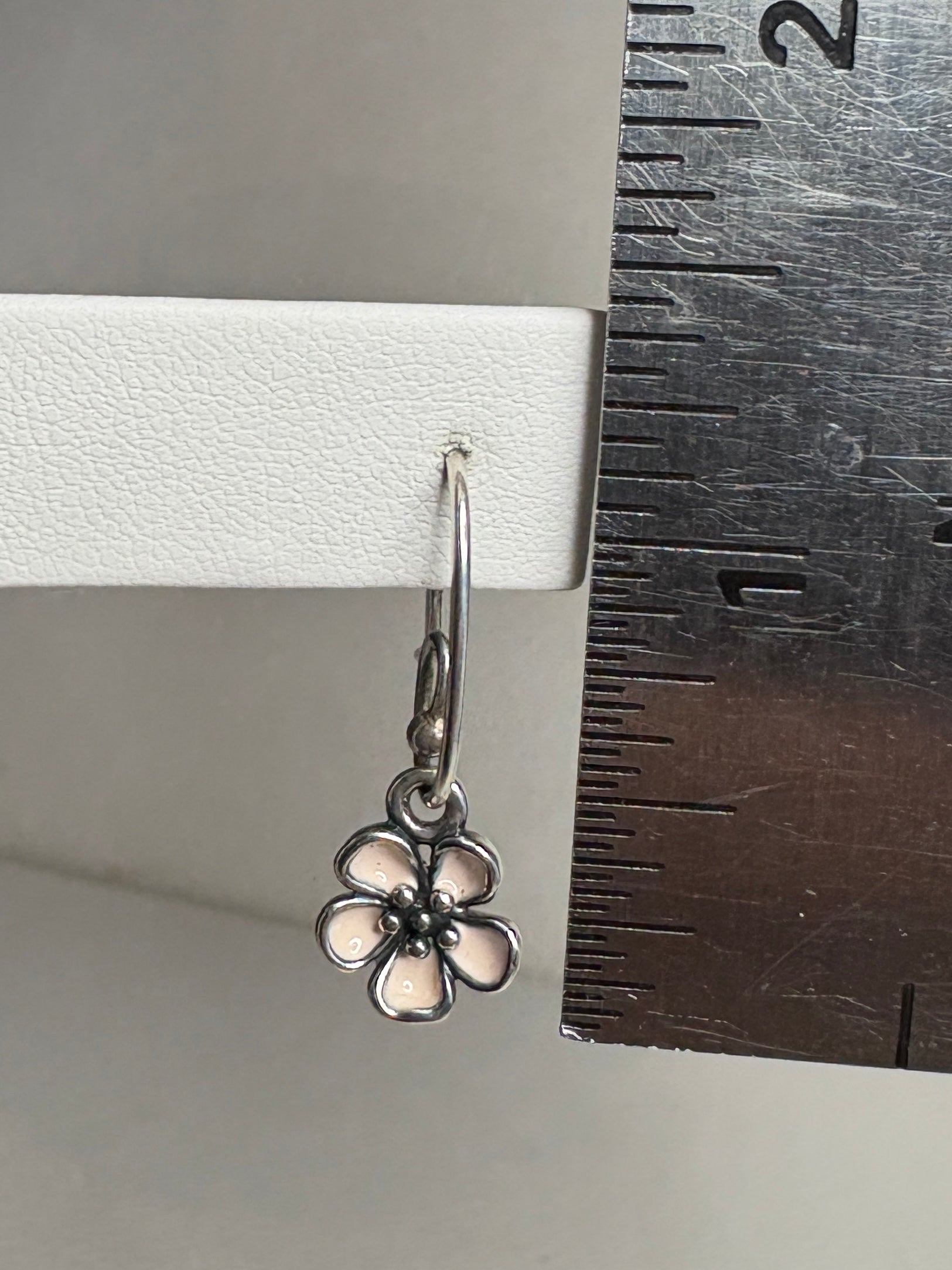 Pandora sterling silver dangle earrings with pink enamel cherry blossom charms.