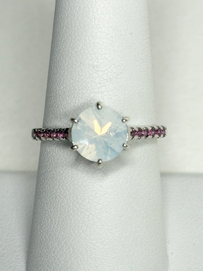 Sterling silver ring with a milky white quartz and rhodolite garnets.