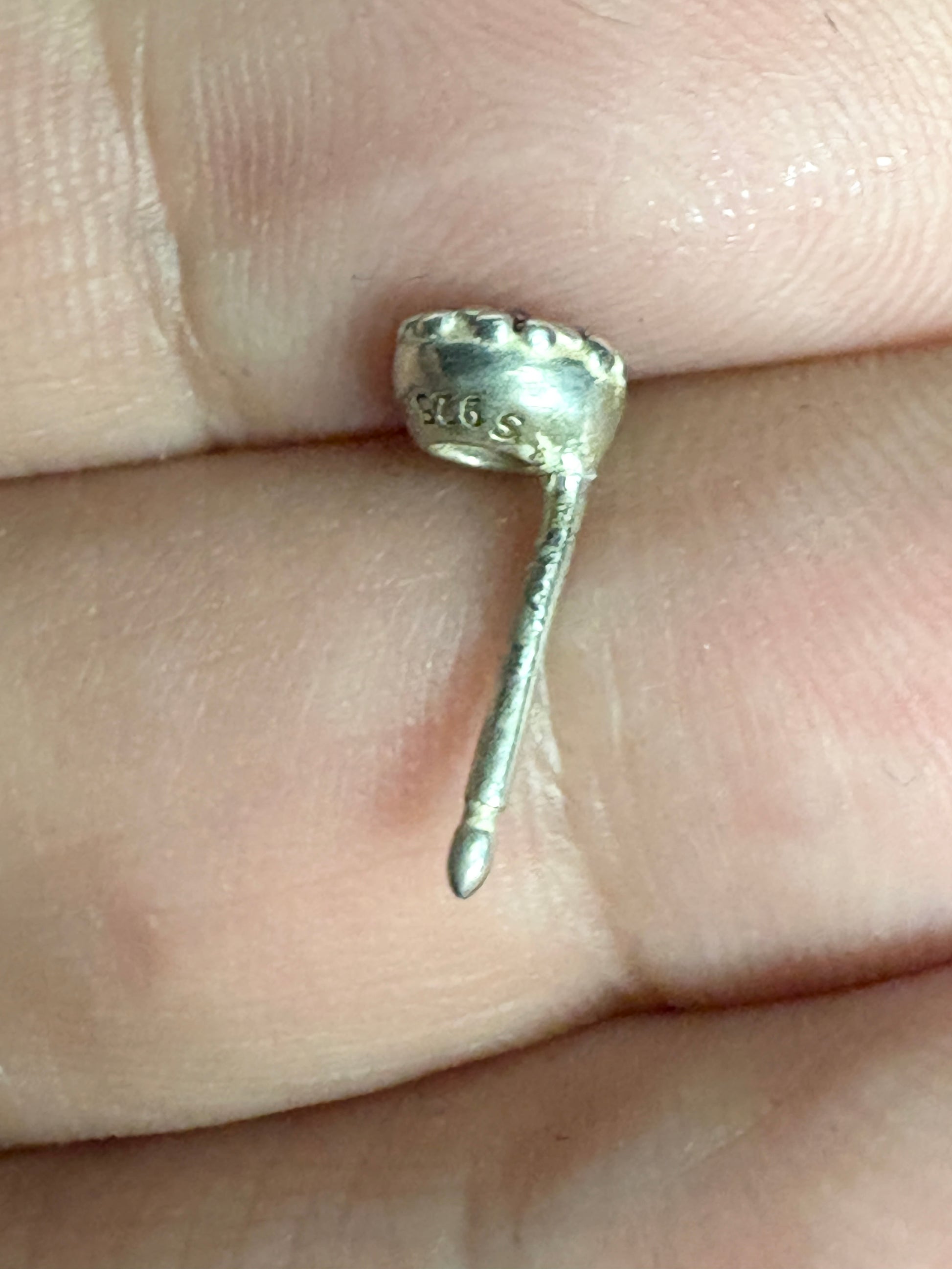 Sterling silver Pandora stud earrings with "S 925" marking.