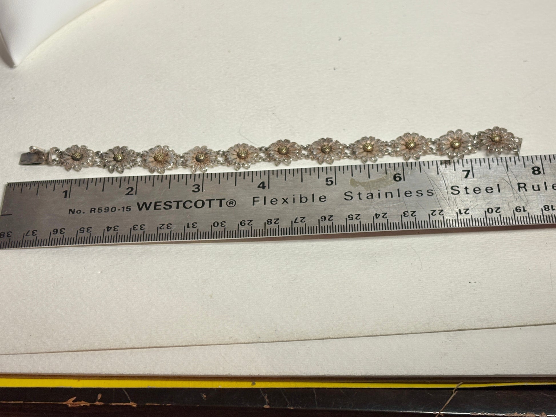 Vintage two-toned 800 silver floral daisy bracelet with gold-plated centers.