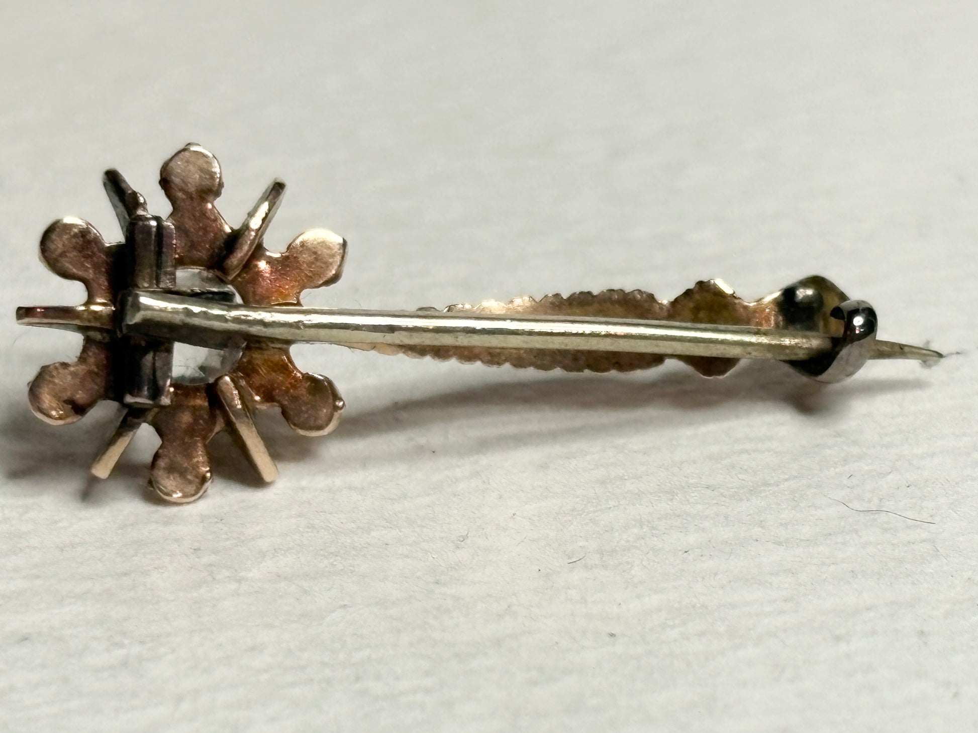 Antique 14k gold brooch with enamel and paste gem, circa 1835.