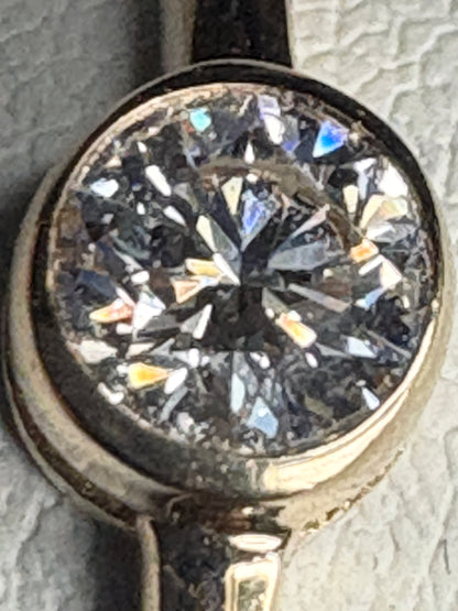 Pandora 14k gold ring with a .25ct bezel-set lab-grown diamond.