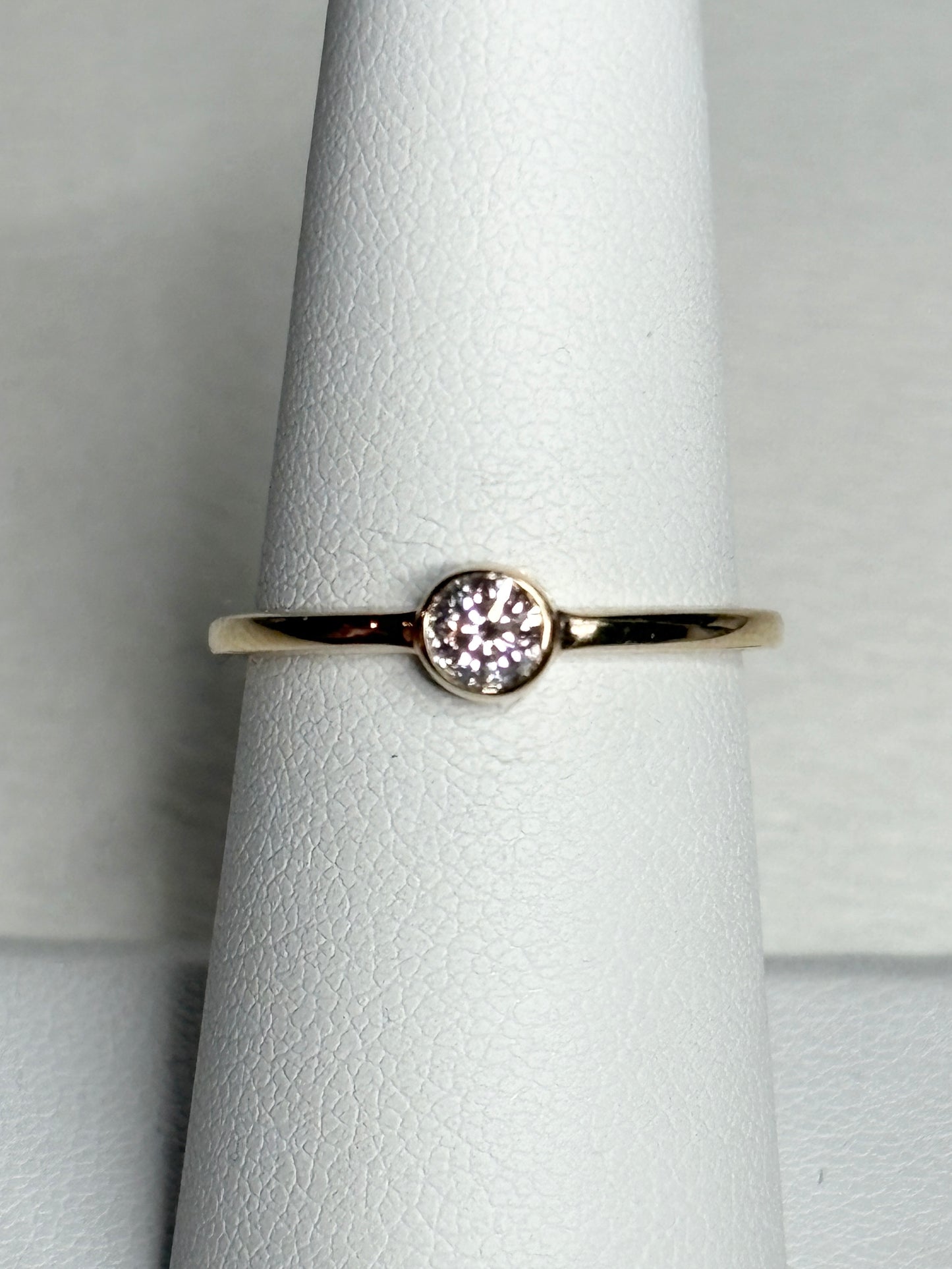 Pandora 14k gold ring with a .25ct bezel-set lab-grown diamond.