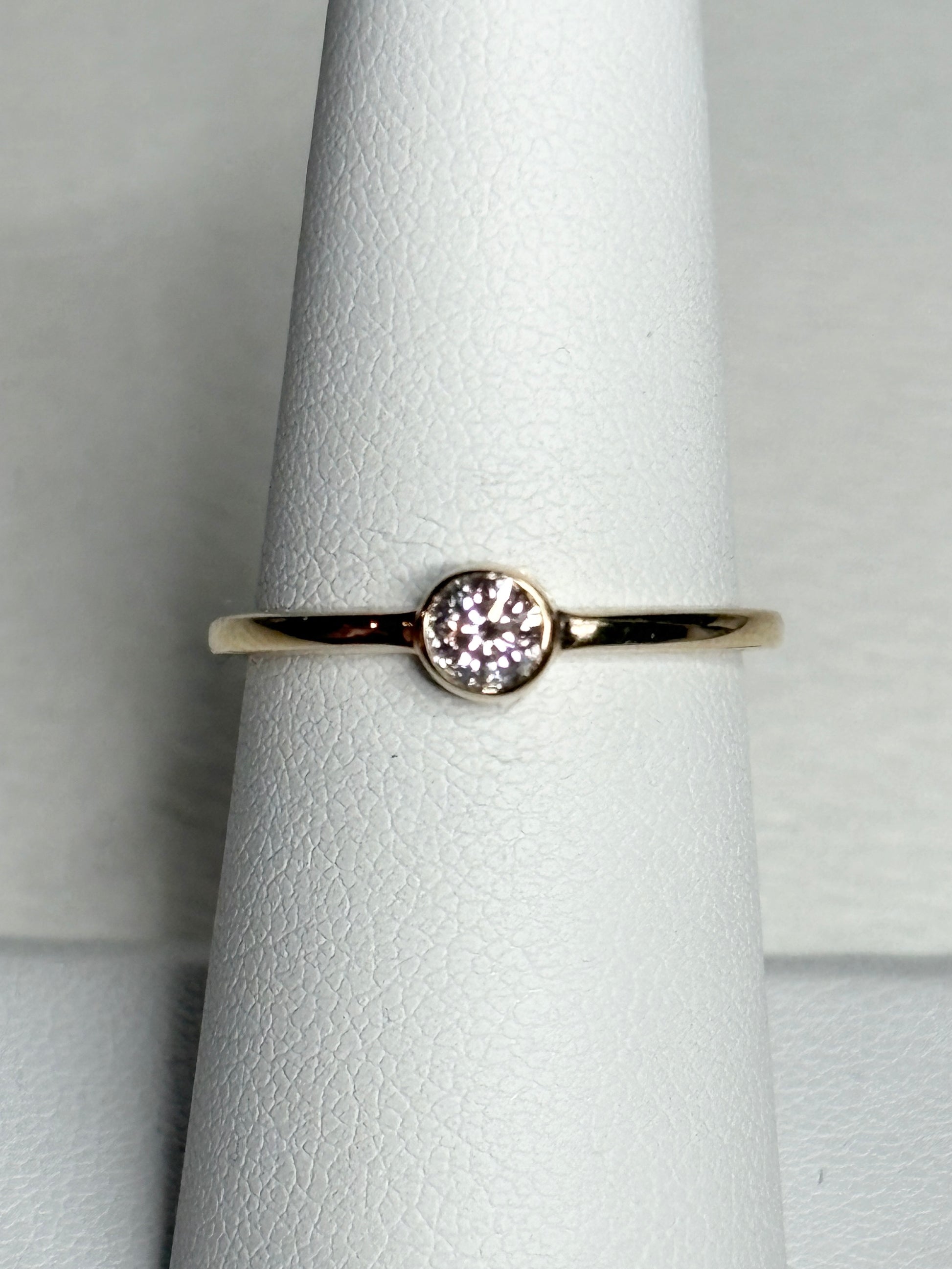 Pandora 14k gold ring with a .25ct bezel-set lab-grown diamond.