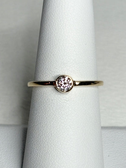 Pandora 14k gold ring with a .25ct bezel-set lab-grown diamond.