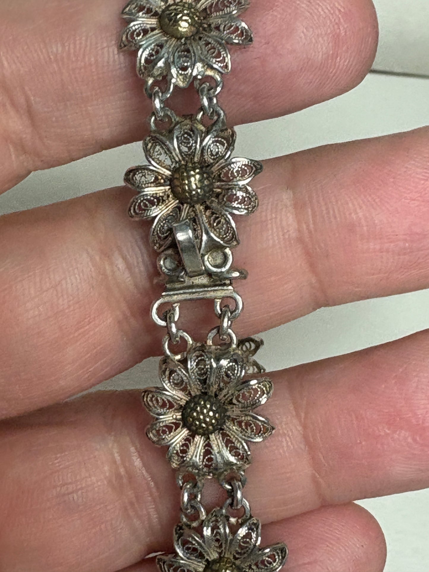 Vintage two-toned 800 silver filigree floral daisy bracelet with gold-plated centers.