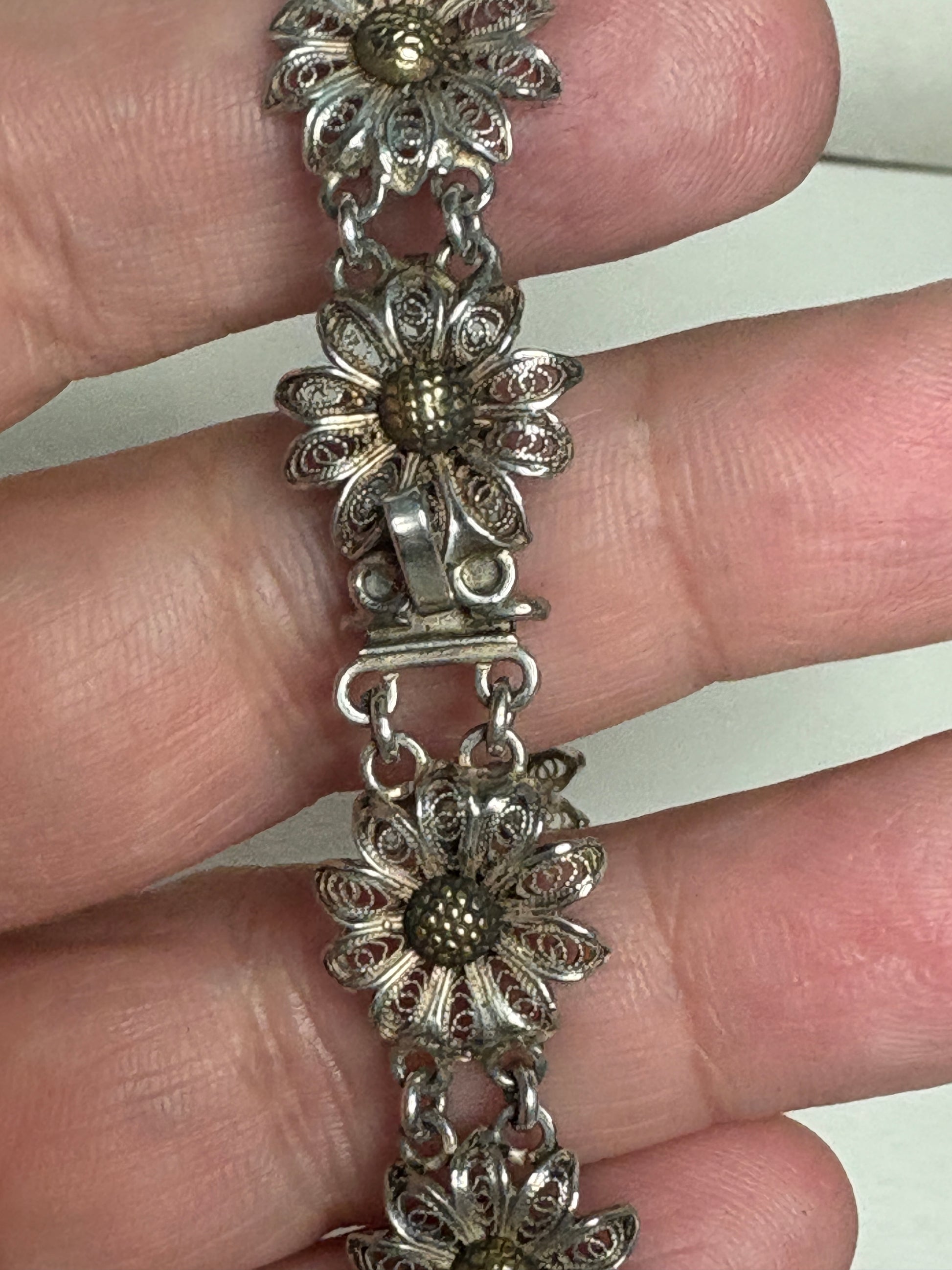 Vintage two-toned 800 silver filigree floral daisy bracelet with gold-plated centers.