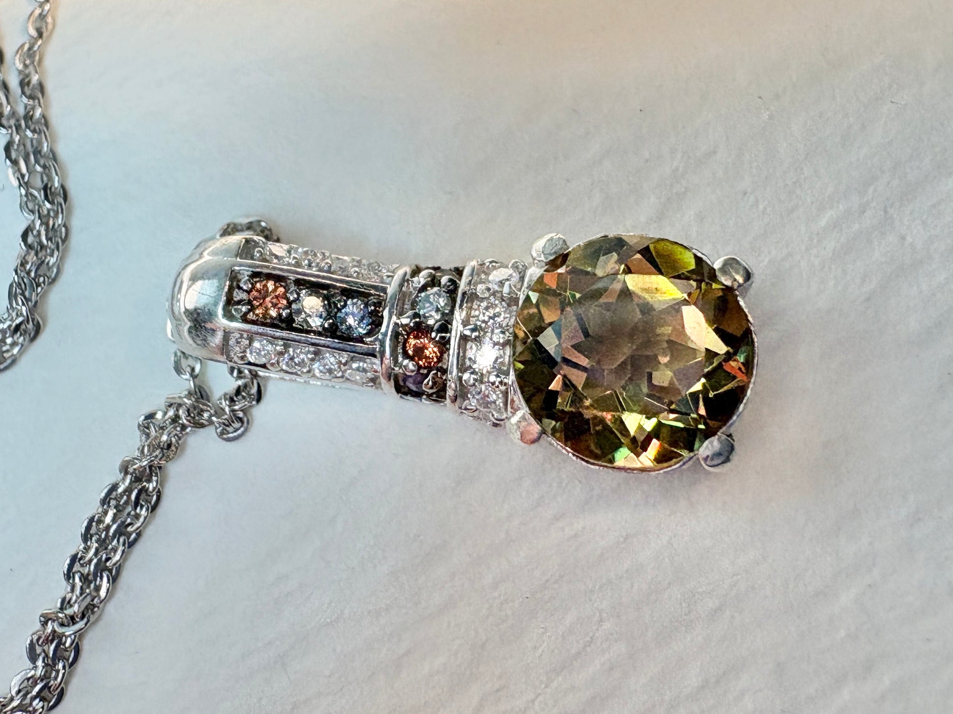 Sterling silver pendant necklace with color-change glass, moissanite, and multi-color sapphires.