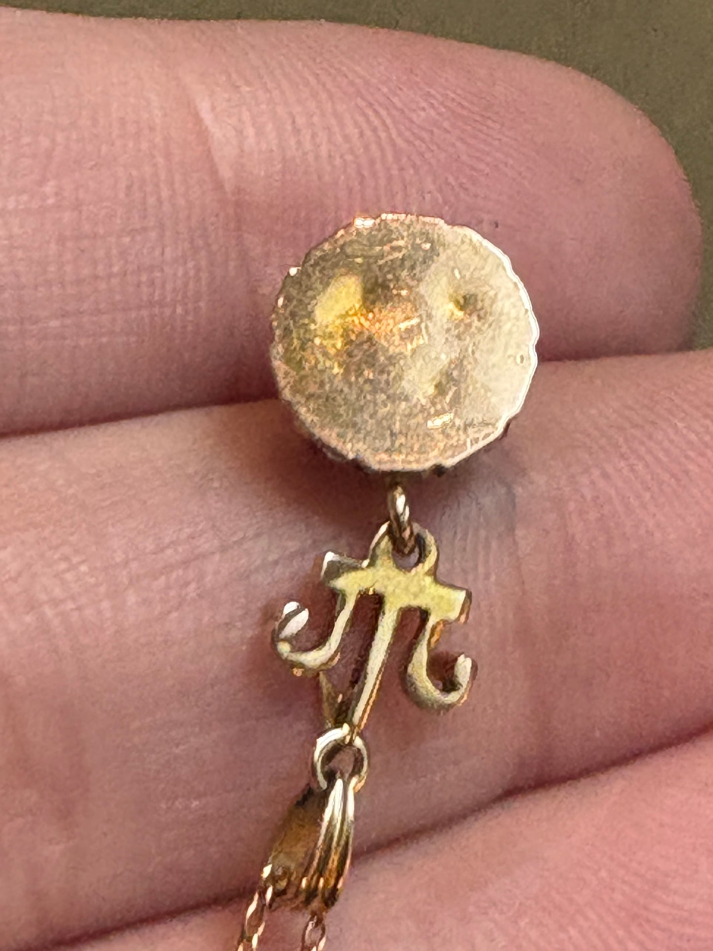 Antique Victorian Etruscan Revival pendant with a rock crystal quartz stone and a 10k gold chain.