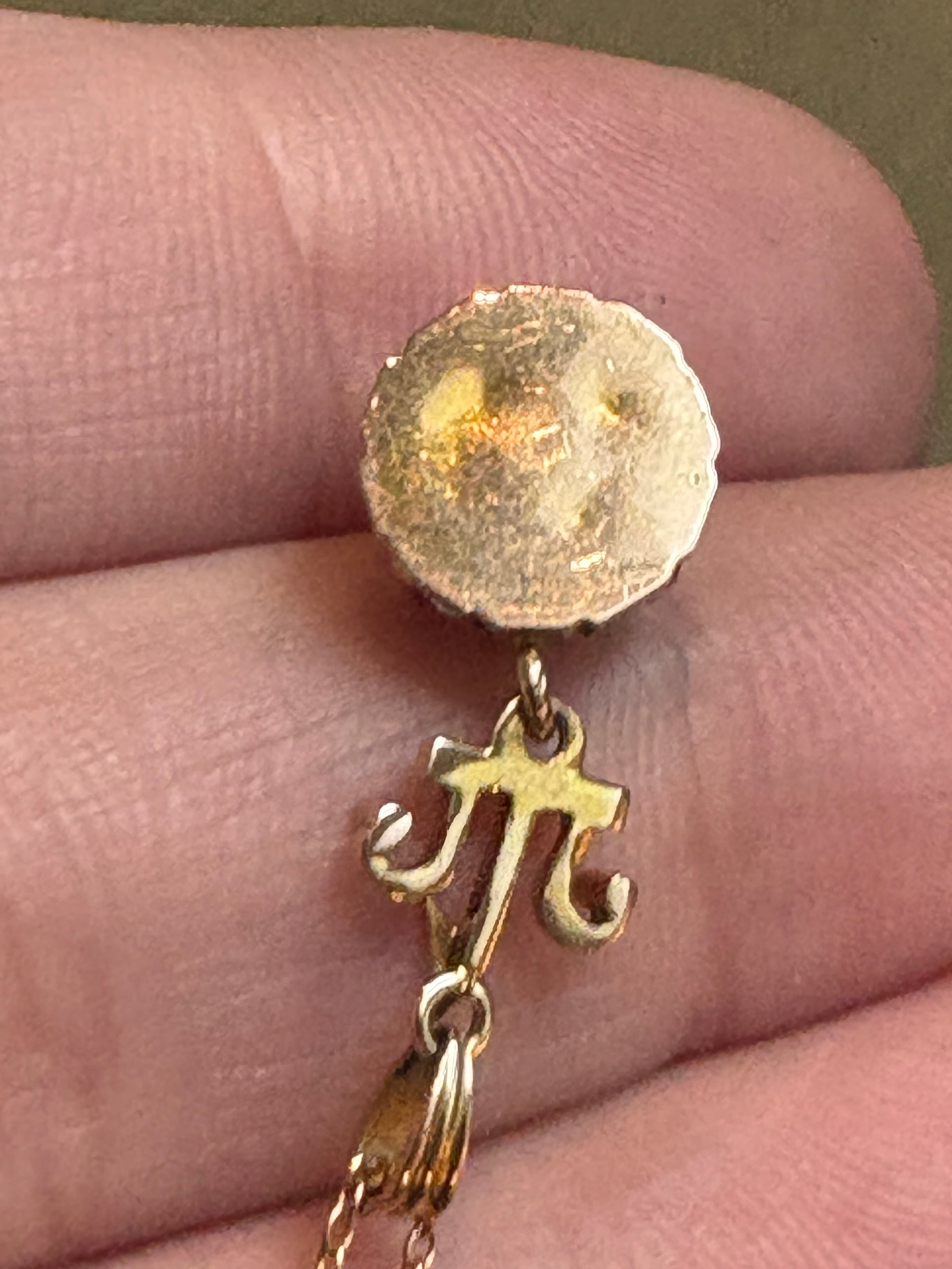 Antique Victorian Etruscan Revival pendant with a rock crystal quartz stone and a 10k gold chain.