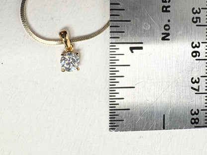 Gold over sterling silver pendant necklace with a moissanite stone.