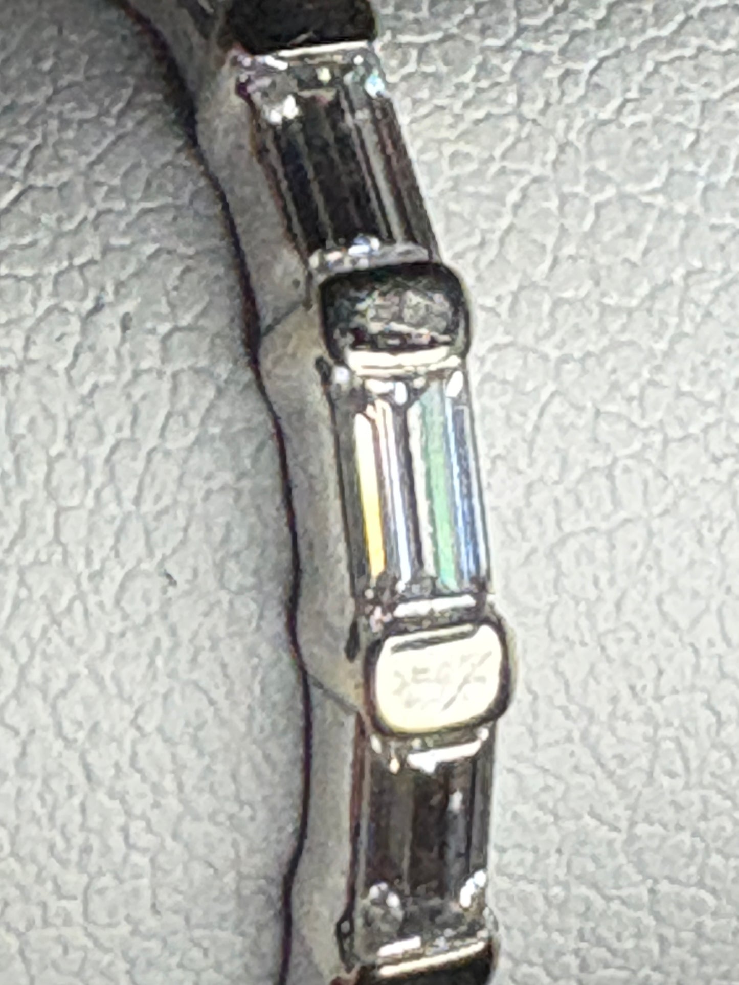 Charles and Colvard baguette moissanite band ring in 14k white gold.