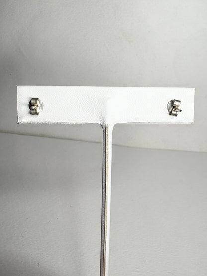 Sterling silver Pandora stud earrings with violet purple pave cubic zirconia stones.