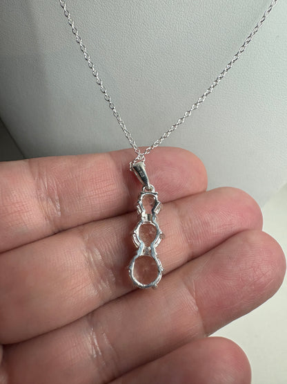 Sterling silver pendant necklace with three natural morganite stones.