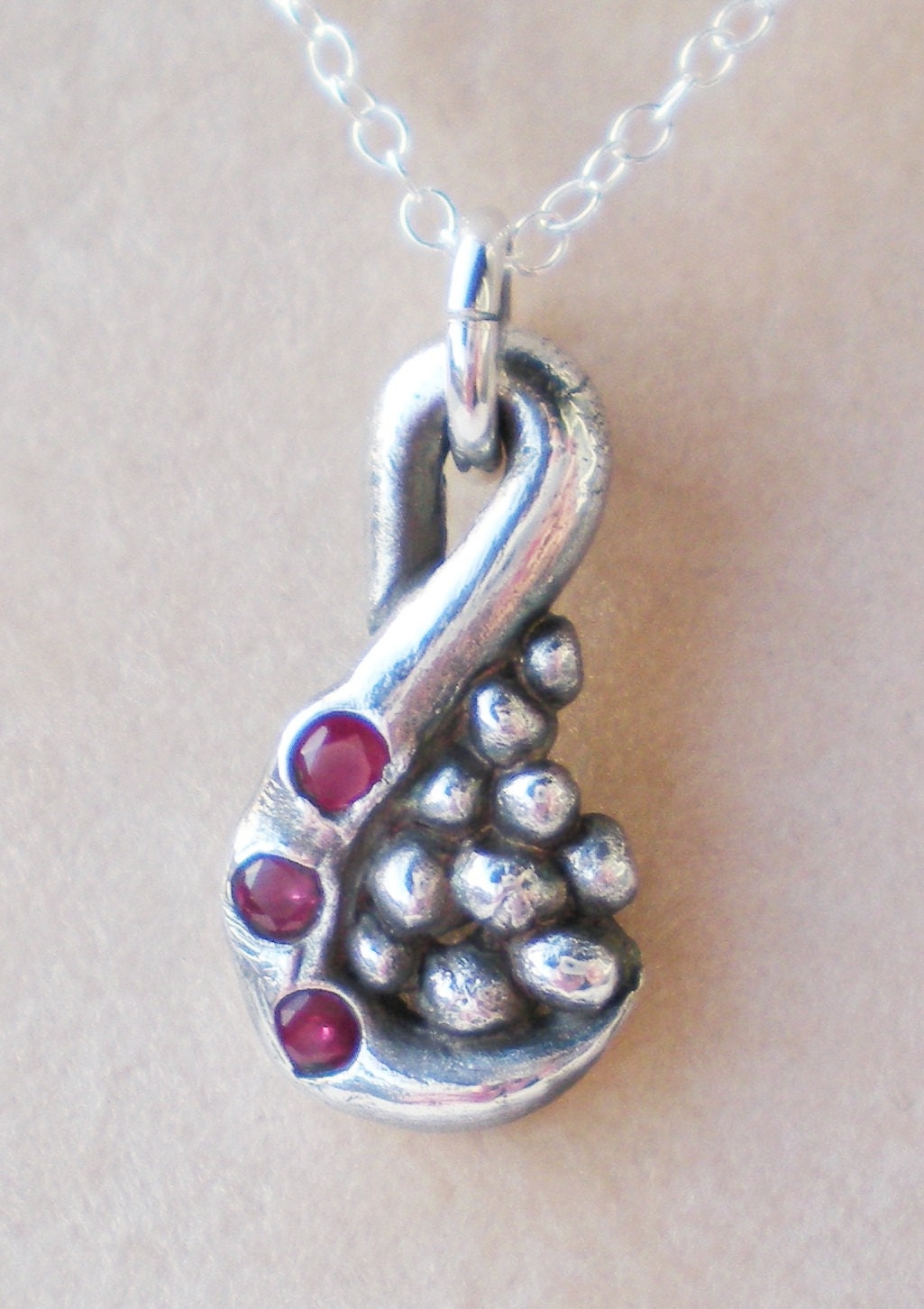 Fine solid silver natural Ruby swirl and pebble pendant
