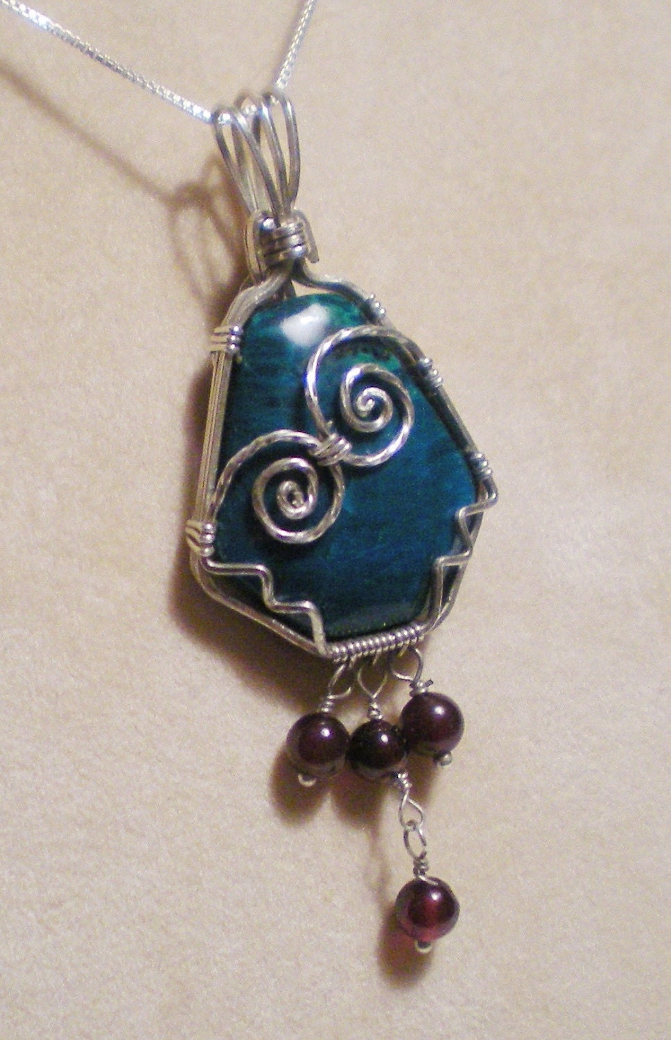 Chrysocolla and garnet sterling silver wire wrapped pendant