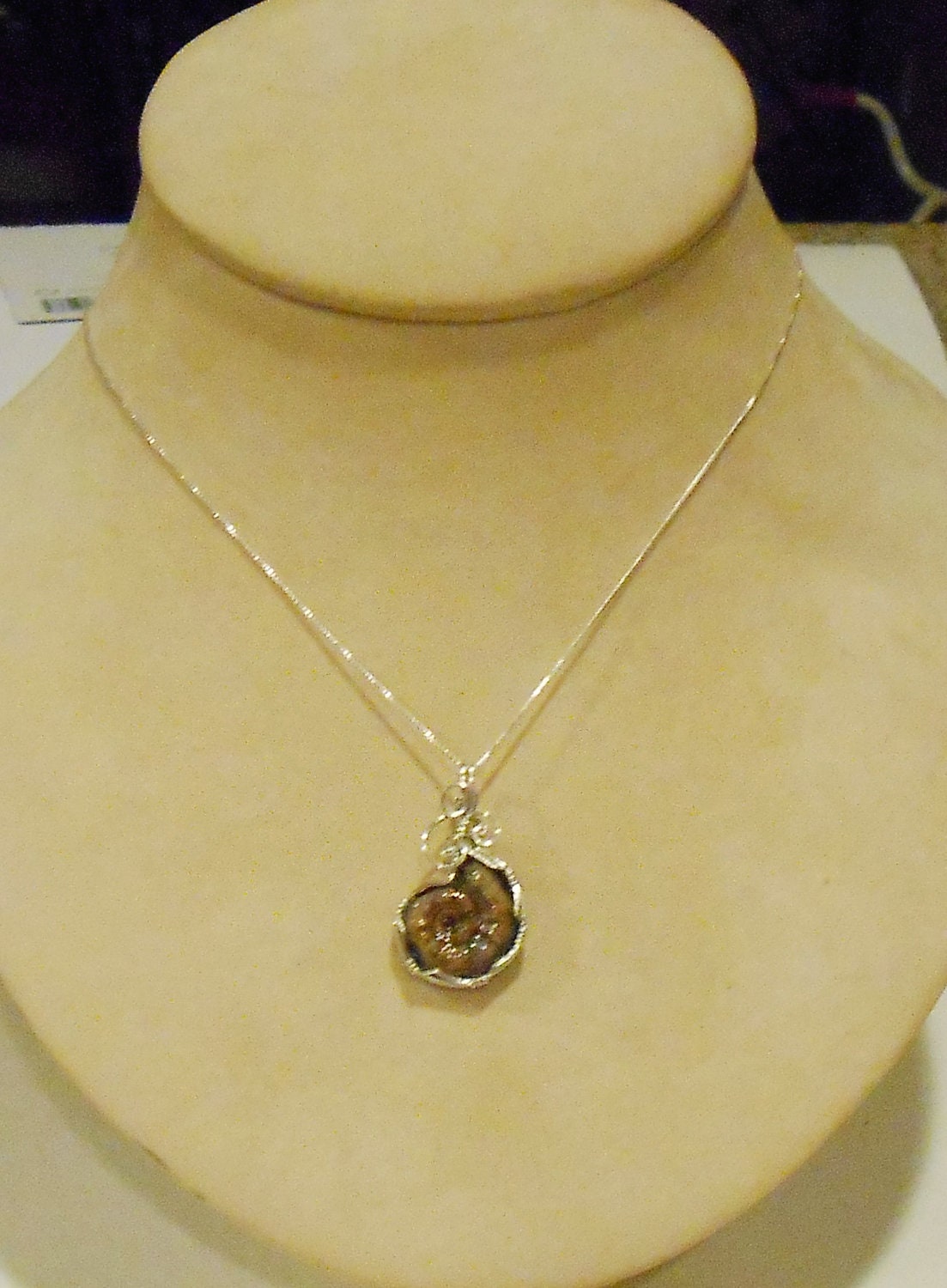 Pyritized Ammonite fossil pendant with ammolite features sterling silver wire wrapped