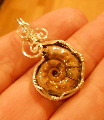 Pyritized Ammonite fossil pendant with ammolite features sterling silver wire wrapped