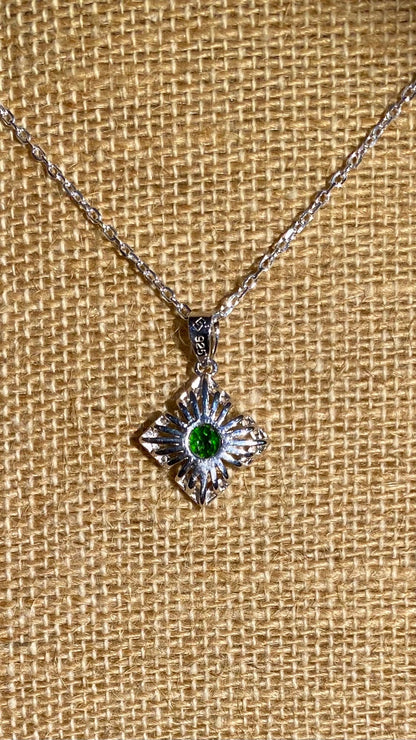 Sterling silver necklace with a square sunbeam pendant featuring a green chrome diopside gem.
