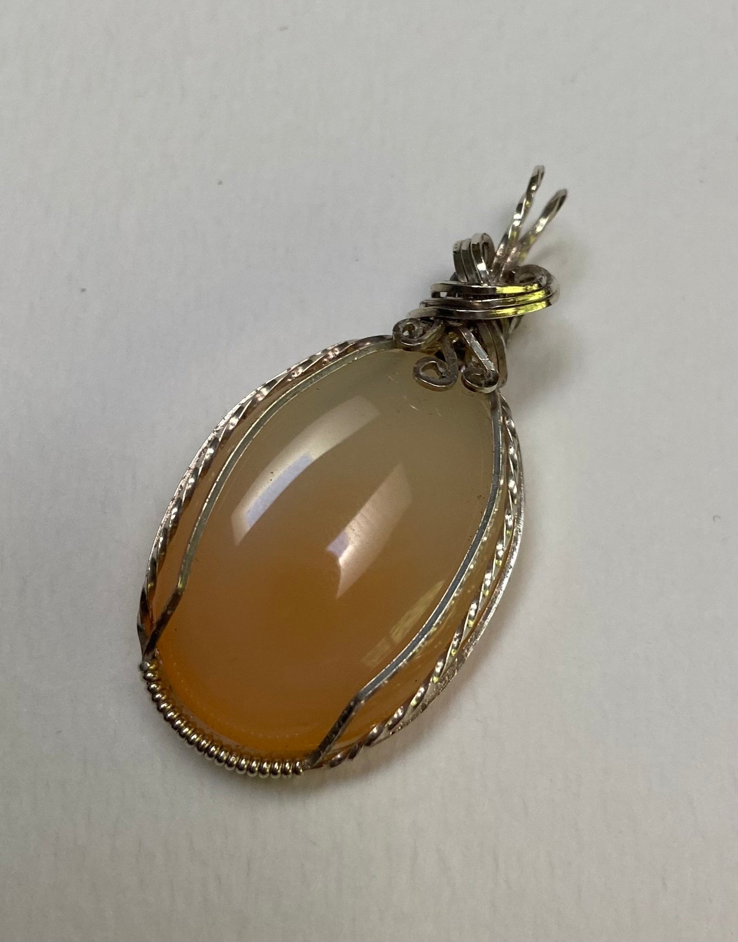Peach Chalcedony sterling silver wire wrapped pendant