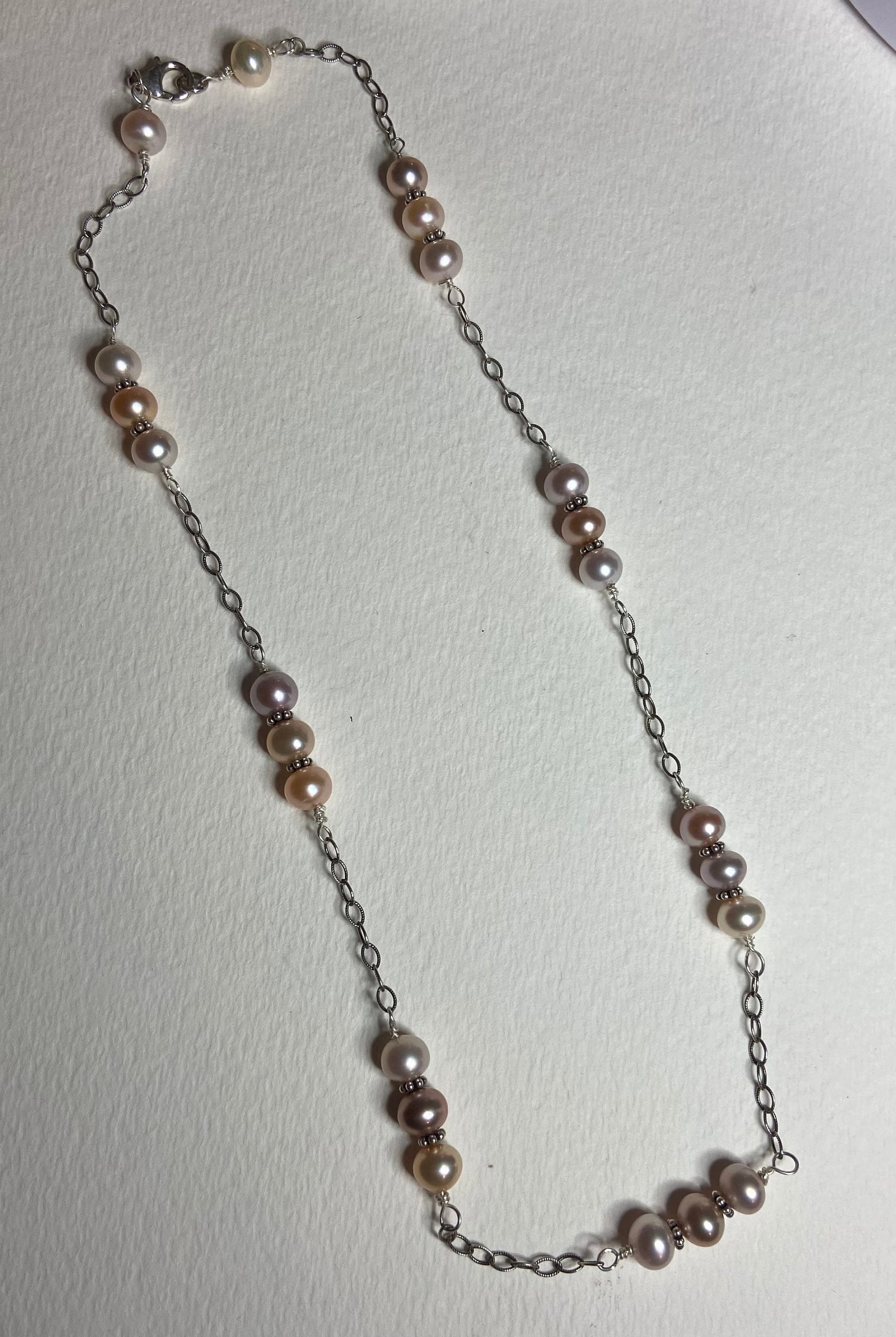 Sterling silver necklace with multi-colored freshwater pearls.