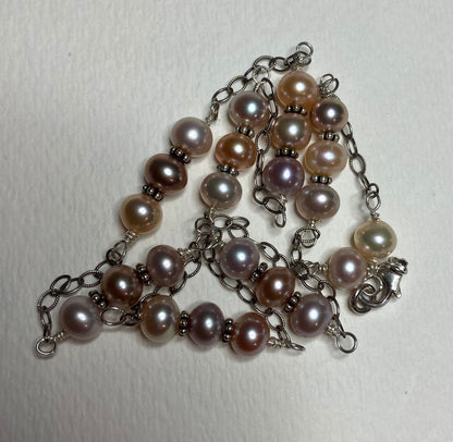 Sterling silver necklace with multi-colored freshwater pearls.