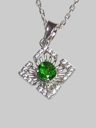 Sterling silver pendant necklace with a green chrome diopside center and cubic zirconia accents.