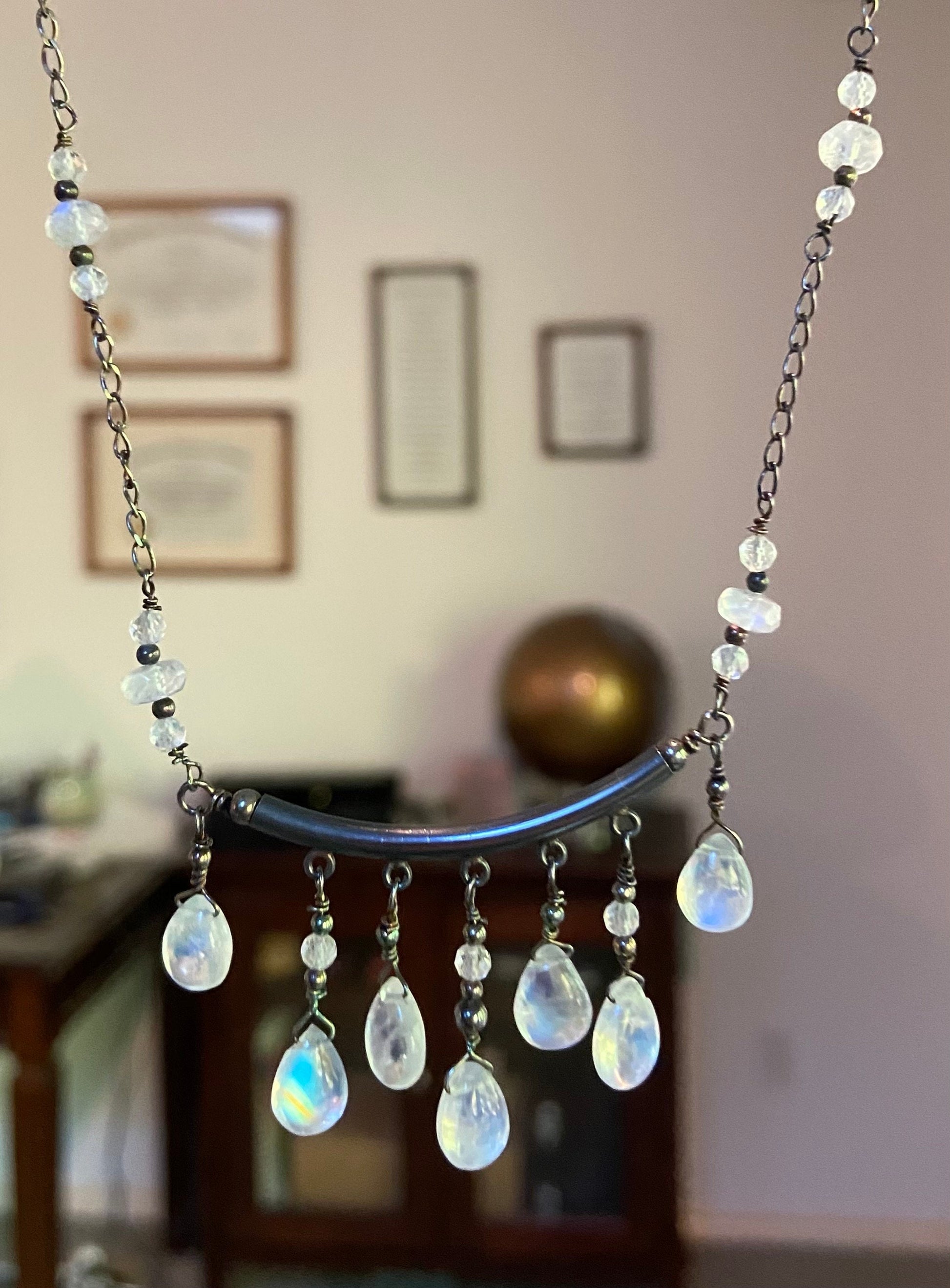 Sterling silver necklace with rainbow moonstone teardrops and rondelles in a black finish.