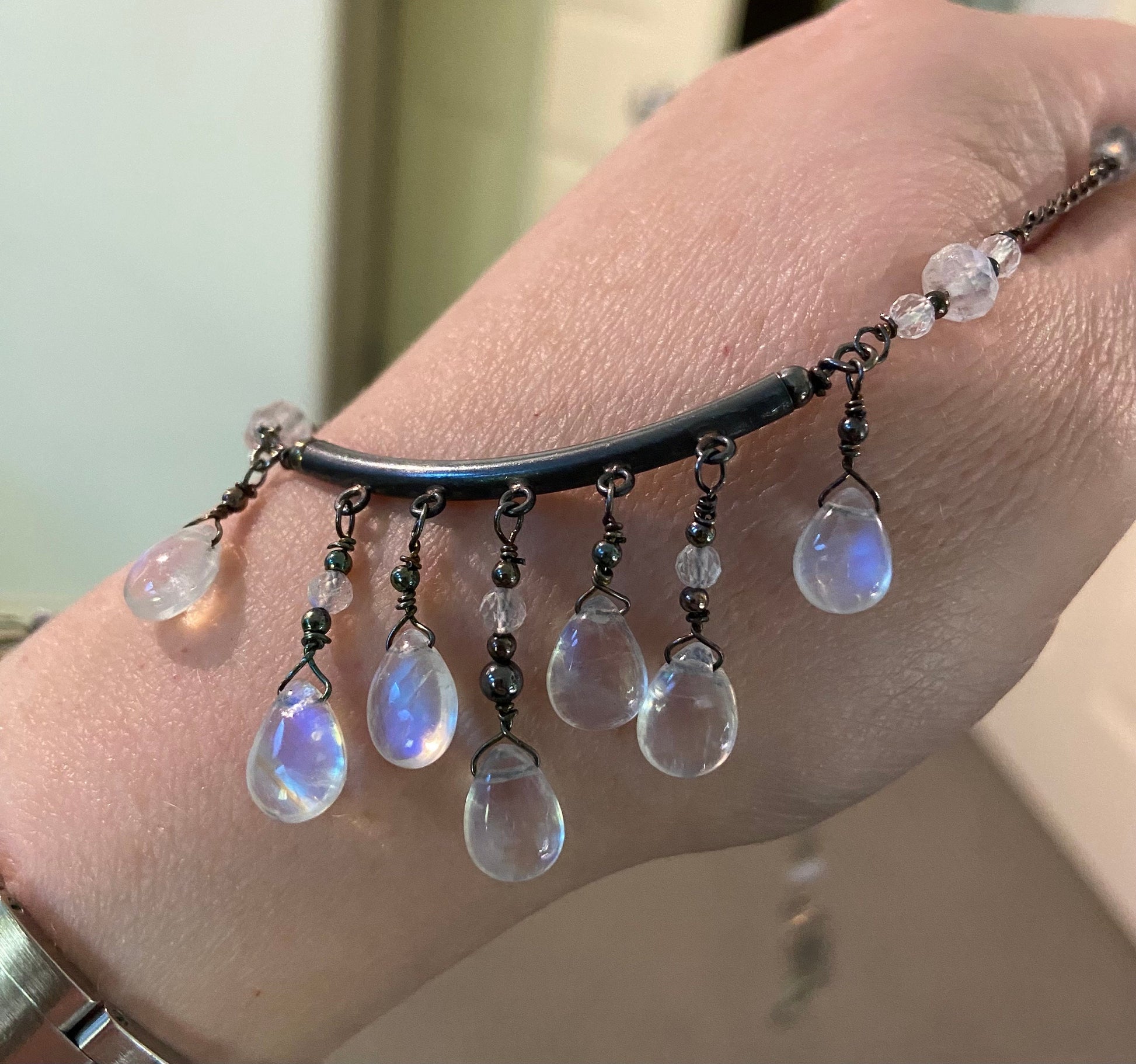 Sterling silver necklace with rainbow moonstone teardrops and rondelles.