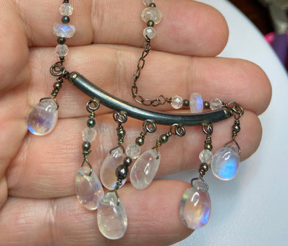 Sterling silver wire-wrapped necklace with rainbow moonstone teardrops and rondelles.