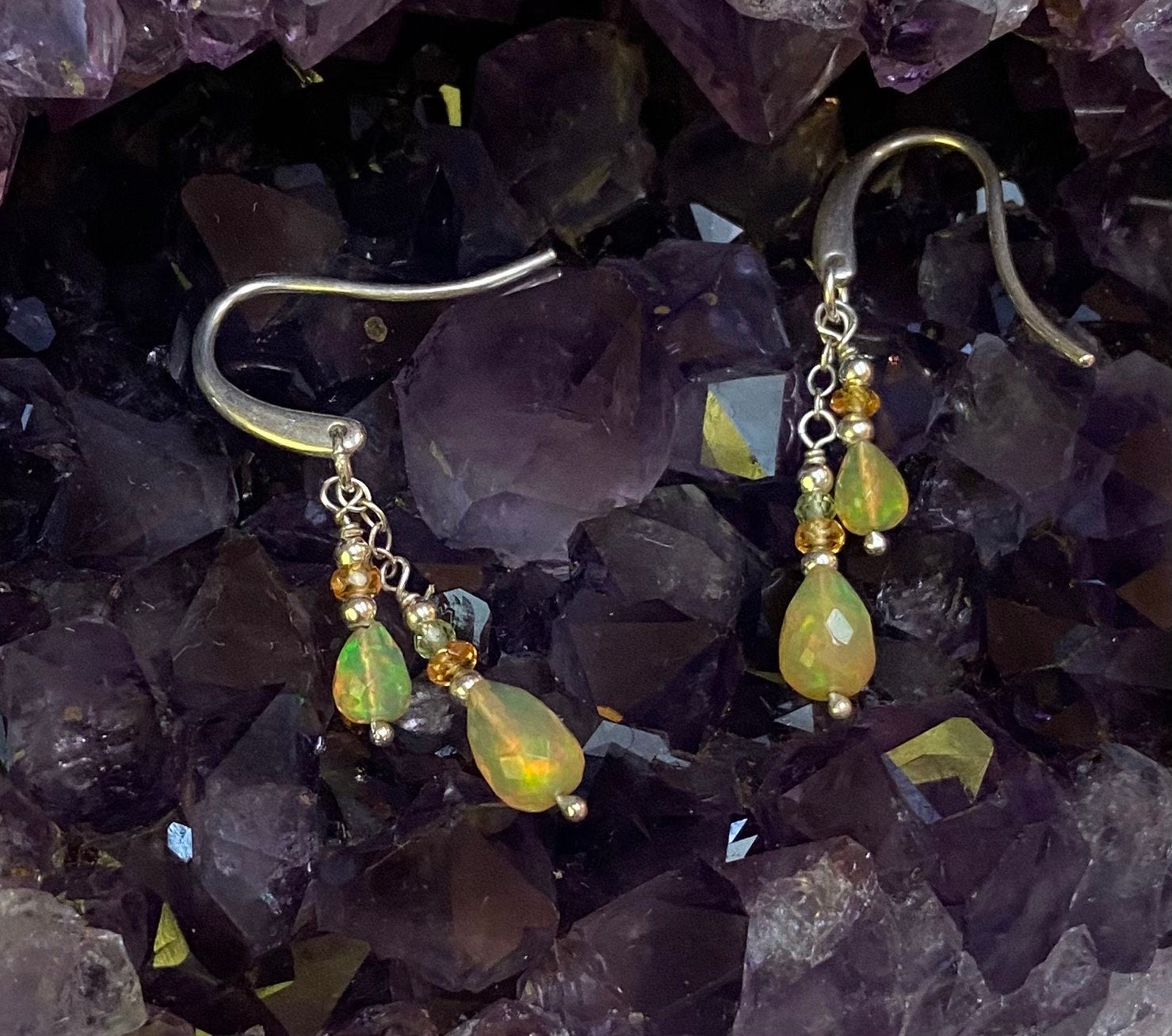 Natural Ethiopian yellow opal dangle drop earrings in sterling silver with peridot and spessartite.