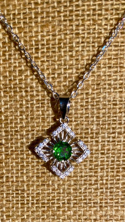 Sterling silver necklace with a square sunbeam pendant featuring a green chrome diopside and cz accents.