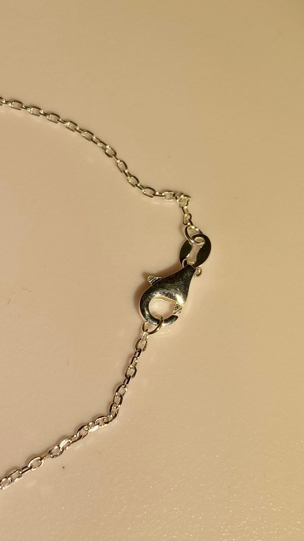 Sterling silver necklace with a lobster claw clasp.