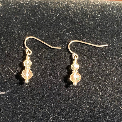 Sterling silver dangle earrings with two Oregon Sunstone beads.