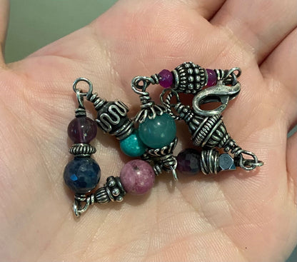 Sterling silver beaded bracelet with multiple colorful gemstones.