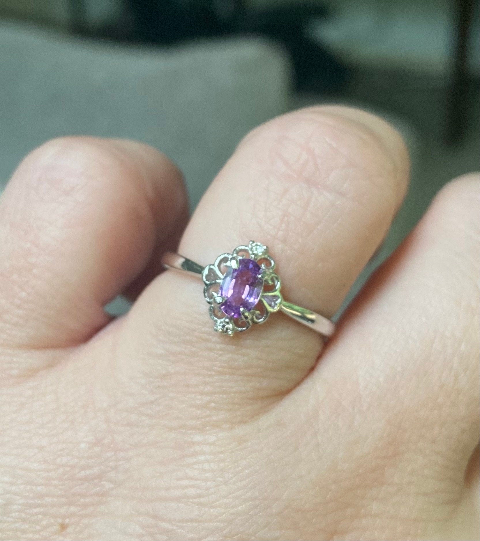 Oval pinkish-purple sapphire and diamond ring in sterling silver.