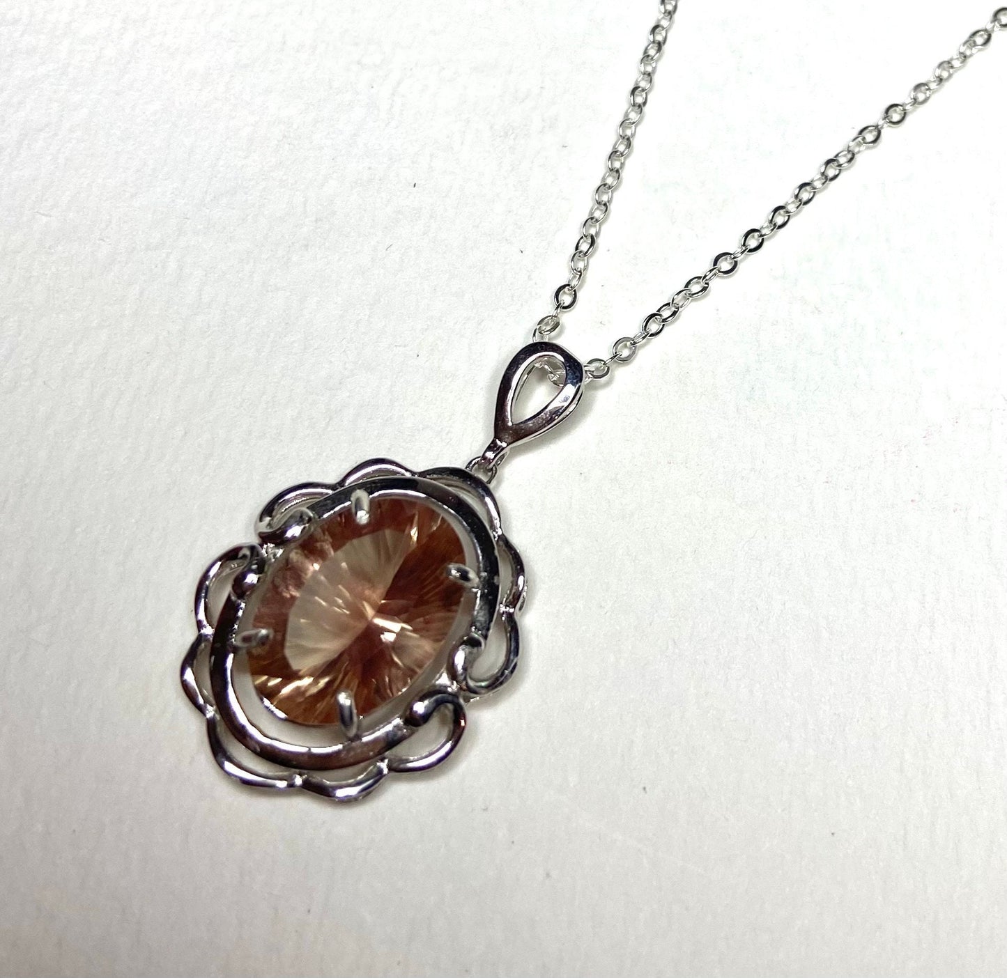 Oval fancy cut Oregon Sunstone pendant necklace in sterling silver.