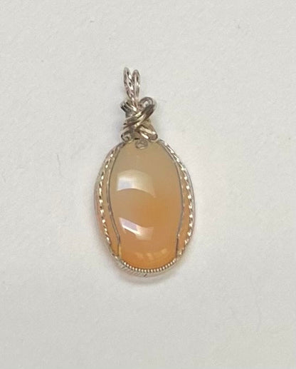Peach Chalcedony sterling silver wire wrapped pendant