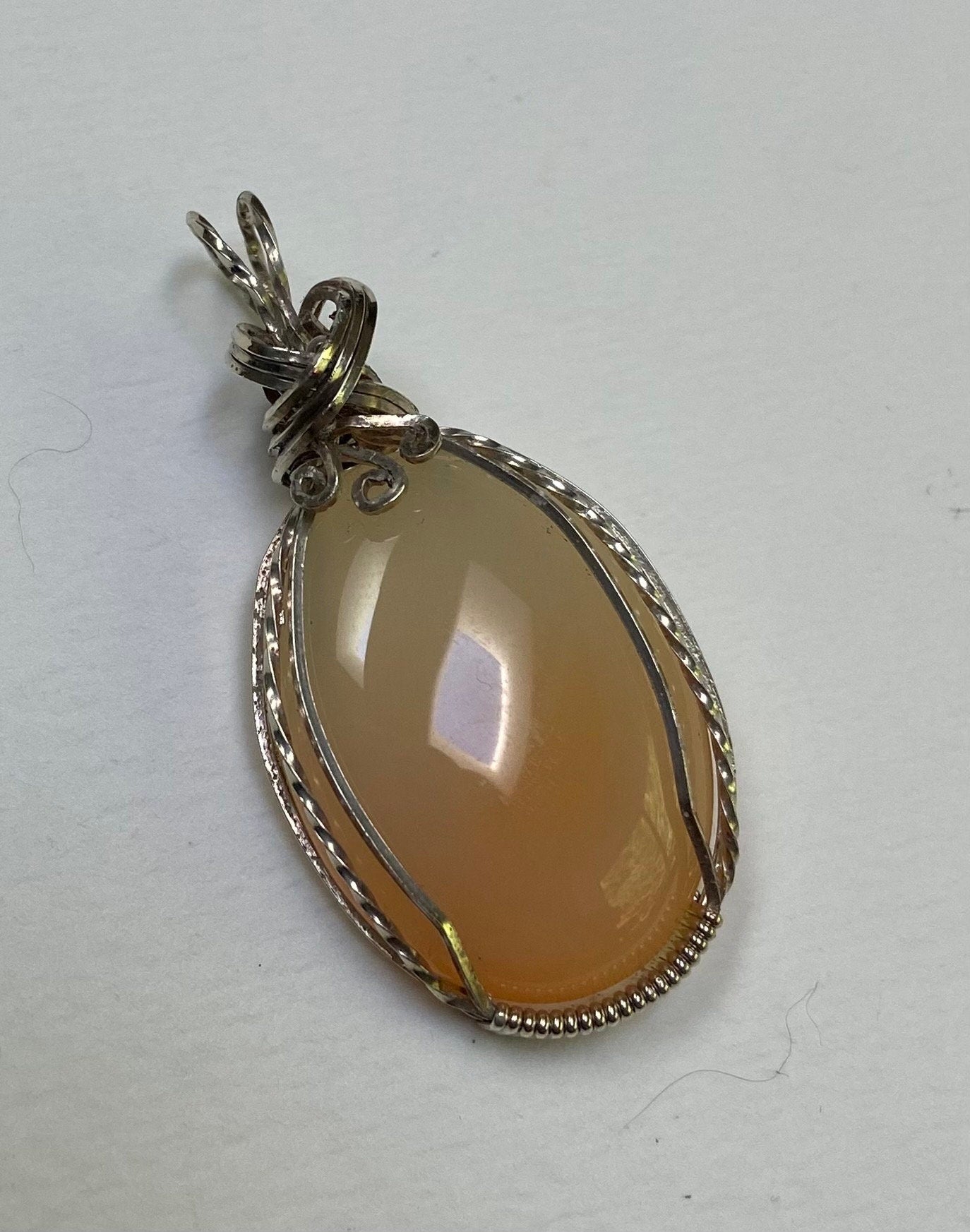 Peach Chalcedony sterling silver wire wrapped pendant