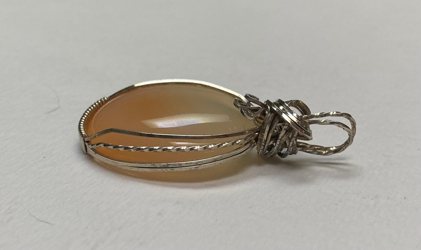 Peach Chalcedony sterling silver wire wrapped pendant